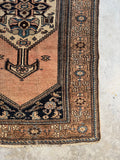 Corner view of 1920s Persian rug in amazing condition with soothing color story.
