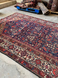 Long Persian rug ideal for wide hallways or large rooms.