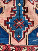 Scorpion motif woven into the end of the rug’s main field.