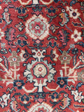 Antique Persian rug low pile texture with supple handle and even wear.