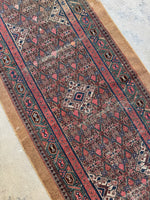 Antique 20-foot Persian runner ideal for long hallways.