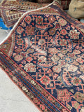 Worn vintage Persian runner ideal for relaxed interiors.