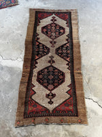 Antique Persian runner with two-tone small scale design.