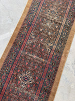 Vintage Persian runner with creamy mocha ground and earthy tones.