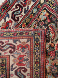 Underside view of nearly 19 foot antique Persian corridor runner.