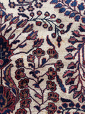 1920s Persian Sarouk ivory rug detailed view of central branching palmettes and rosette motifs.