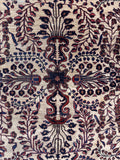 Large ivory Persian Sarouk area rug 11x14 close up view of central floral design.
