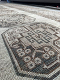 Vintage hand knotted Persian Shiraz with an oatmeal field and subtle tribal motifs.