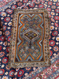 Authentic Persian scatter rug woven with hand-spun wool and natural vegetable dyes.