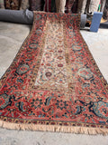 Late 19th-century antique Persian runner featuring classic turtle motifs and a timeworn, shabby chic character.