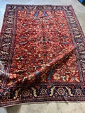 Antique Persian Tabriz rug, 8x11, full view with tribal design.