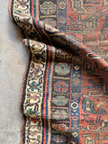 Primitive Persian scatter rug with tribal floral design, hand knotted antique wool area rug.