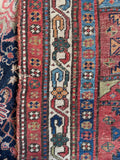 Close up of border bands of heavy durable antique Persian rug showing its dense weave and low aged pile.
