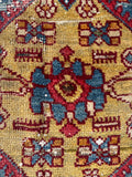 Small Persian collector rug in 4x7 size with rich folk art motifs and a bright, happy aesthetic.