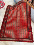 Red and cream striped antique Persian area rug measuring 4 foot 3 inches by 6 foot 1 inch.