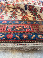 Side view of hand-knotted Persian rug .