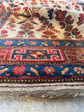 Side view of hand-knotted Persian rug .