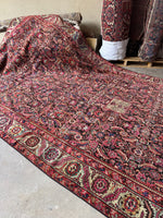 Top-down view of antique Caucasus rug layout