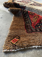 Antique runner with paisley details at the ends.
