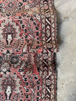 Skinny antique runner showcasing intricate Persian floral patterns and border bands.