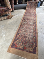 Antique 1920s Persian Seraband runner with camel hair and lattice design.