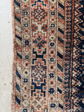 Border detail showing fence of security motif in an antique Shiraz rug.