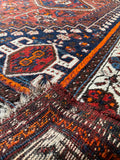 Close up of underside of natural wool foundation on antique Shiraz tribal rug.