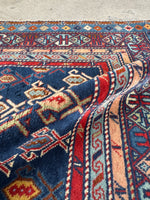 Luminous wool Caucasian rug with natural sheen and glow.