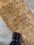 2'8 x 20'8 golden antique hallway runner featuring delicate botanical motifs and beautiful aged patina.