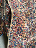 Side view of machine woven Karastan runner 21 ft 5 in x 35 in with even wool pile and floral sprays.