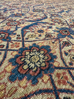 Close-up of a patterned rug with intricate designs.