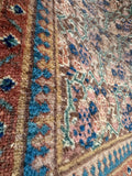 Hand knotted Persian Tabriz rug 10’4 x 14’ vegetable dyed wool closeup.