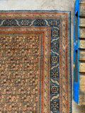 Corner view of 1920s handwoven Tabriz rug 10’4 x 14’ rich vegetable dyed wool.