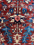 Antique Tabriz rug showing balanced symmetry.