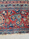 Authentic 1920s Persian area rug hand knotted by master weavers in Tabriz.