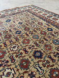 Hand knotted Caucasian Shirvan rug with low pile and scattered wear.