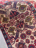 Antique Caucasian rug can be displayed as a small woven textile art piece.