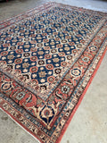 1940s hand-knotted Persian Veramin rug featuring classic village Mina Khani design structure.
