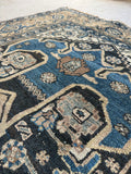 Vintage Persian Malayer rug with vegetable-dyed wool and denim blue tones.