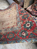Vintage tribal runner, authentic Caucasian hand knotted rug with a floppy handle, open field design, and timeworn antique character.