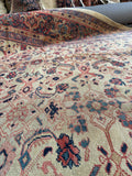 Antique Persian area rug. Circa 1910 Village Mahal rug featuring a rare ivory field, Herati motifs, and a soft worn patina.