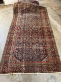 Antique Persian Ferahan rug. Circa 1900 hand knotted wool gallery rug with a navy field and dense Herati Fish design.