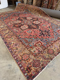Antique wool rug 8x11 coral vegetable dyed Heriz Persian.