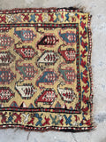 Antique tribal Caucasian rug with repeating paisley boteh design, hand knotted vegetable dyed wool yellow scatter rug.