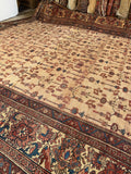 Hand-knotted antique area rug with vegetable dyes and traditional Persian craftsmanship.