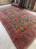 Diagonal view of tribal motifs in a Persian Bidjar rug.