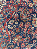Ornate traditional Persian Tabriz area rug showcasing classic floral motifs.