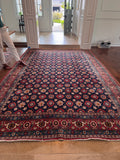 1940s Tehran Persian rug laid out flat showing full 7x11 field and border design.