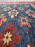 Soft-touch hand-knotted wool antique rug from the Caucasus region north of Persia.