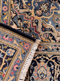 Underside view of an antique Persian rug handwoven with vegetable dyed wool.